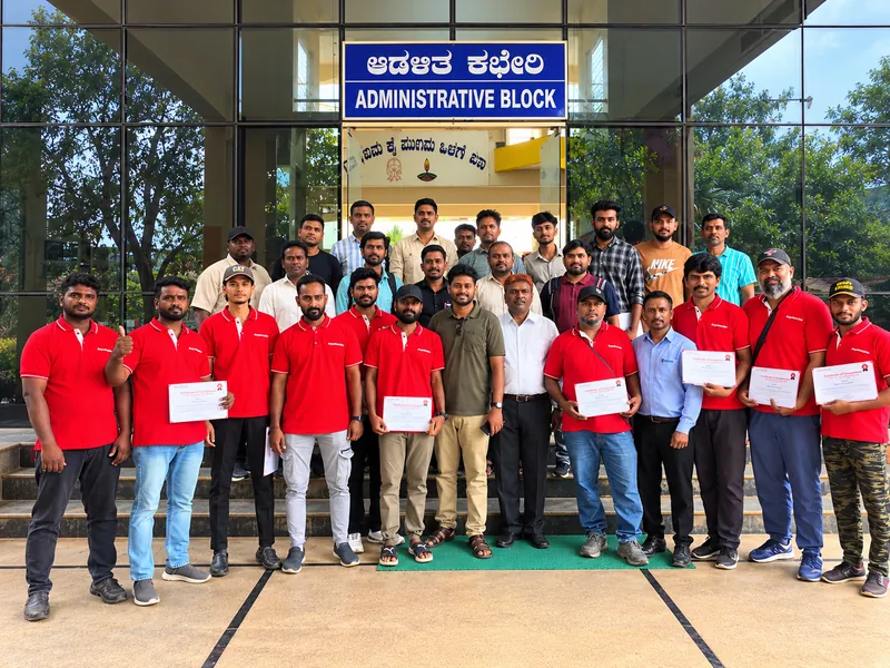 Trailer driver candidates holding their certificates at the Bangalore centre